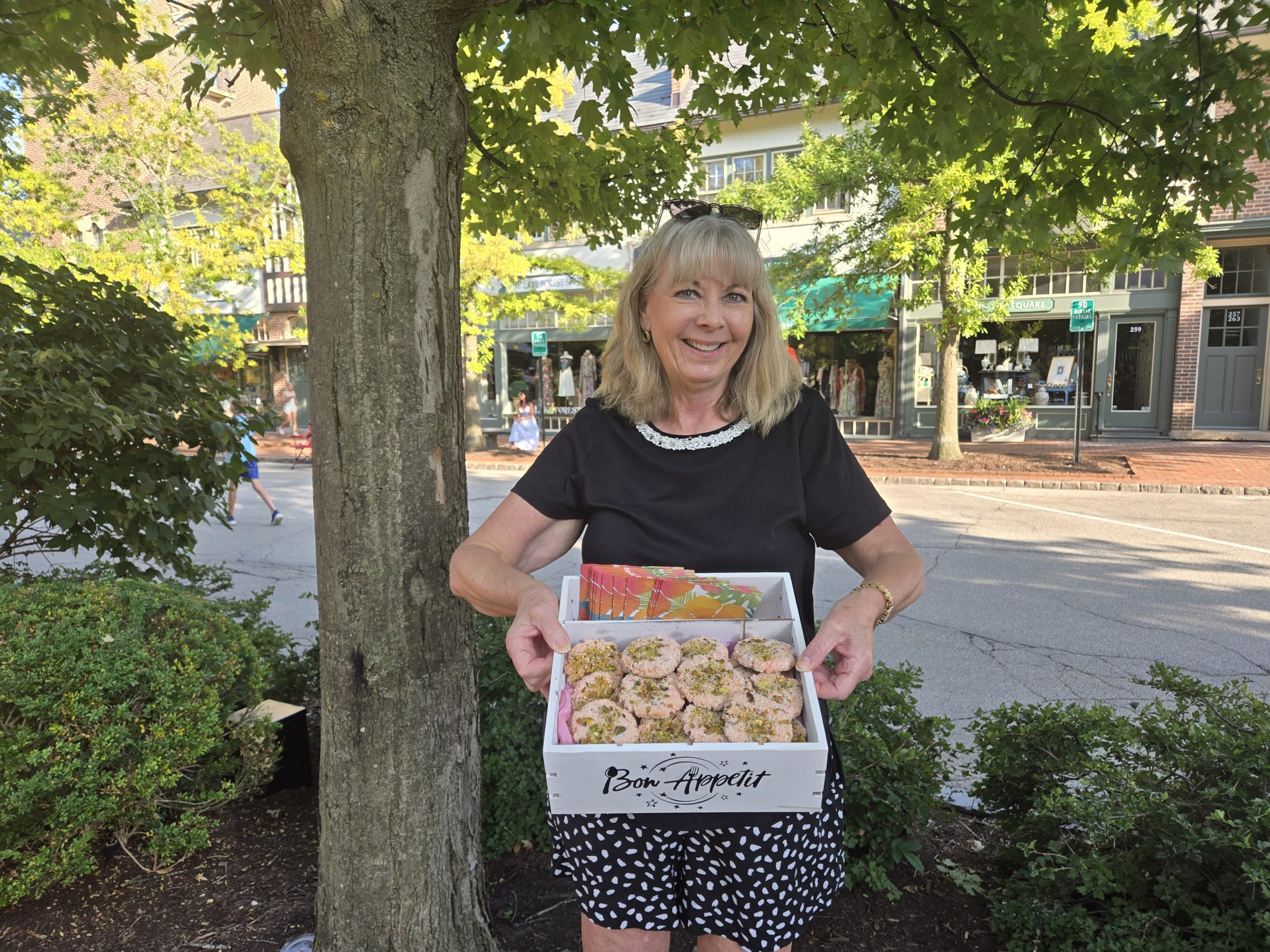 Pam Devendorf holding a tray of homemade lemon strawberry Kool-Aid cookies at Lake Forest Market Square in Lake Forest, Illinois.